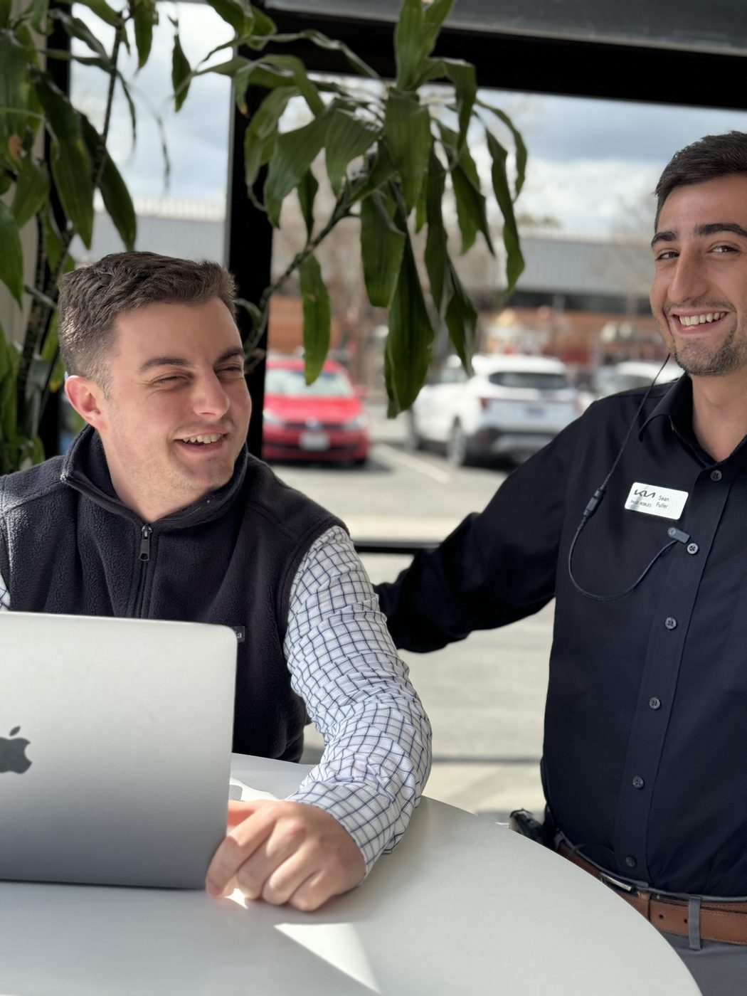 James Permenter working at a car dealership with a colleague